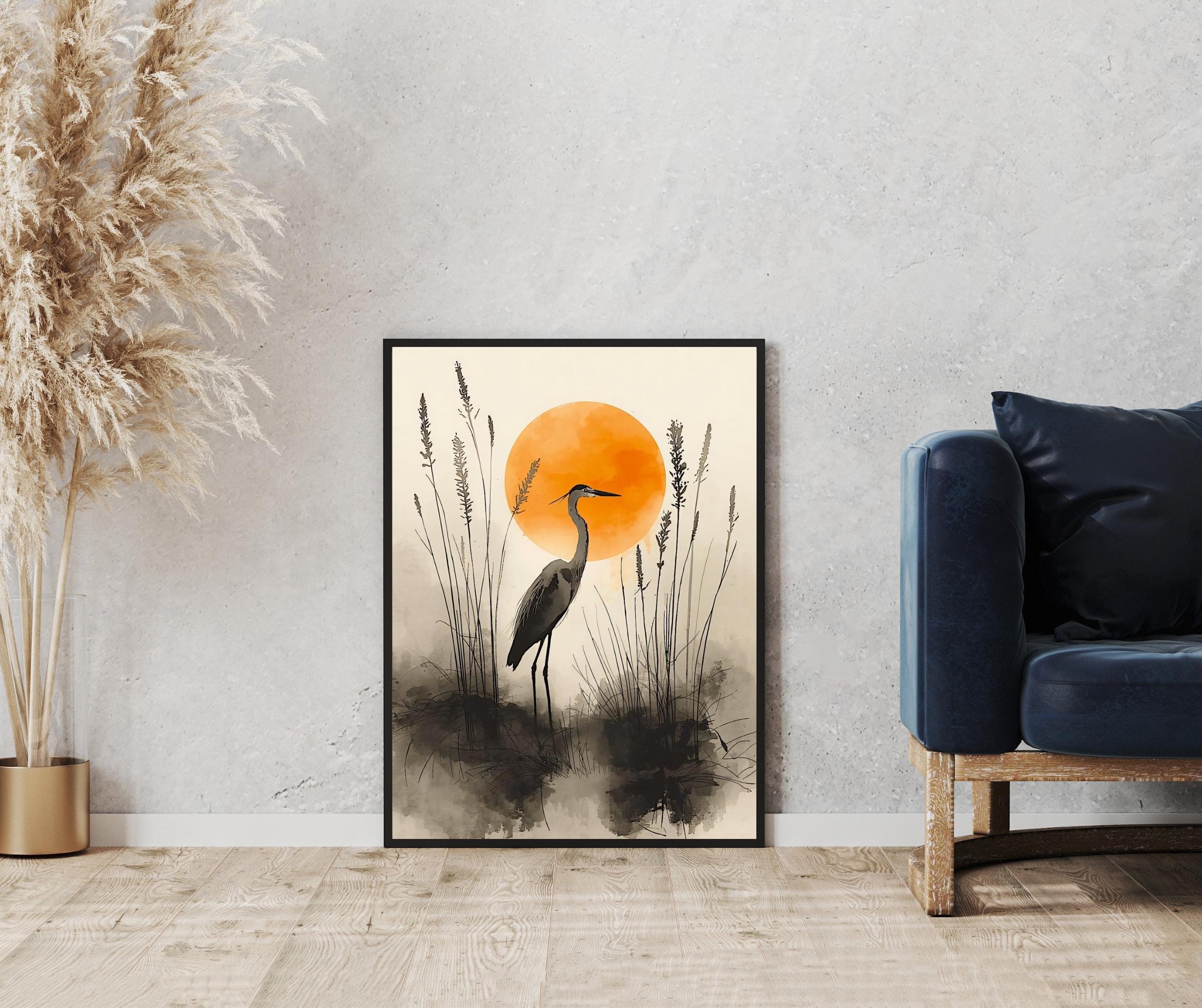 Watercolor bird artwork of a heron standing among tall grasses with a soft, hazy sunset sun behind.