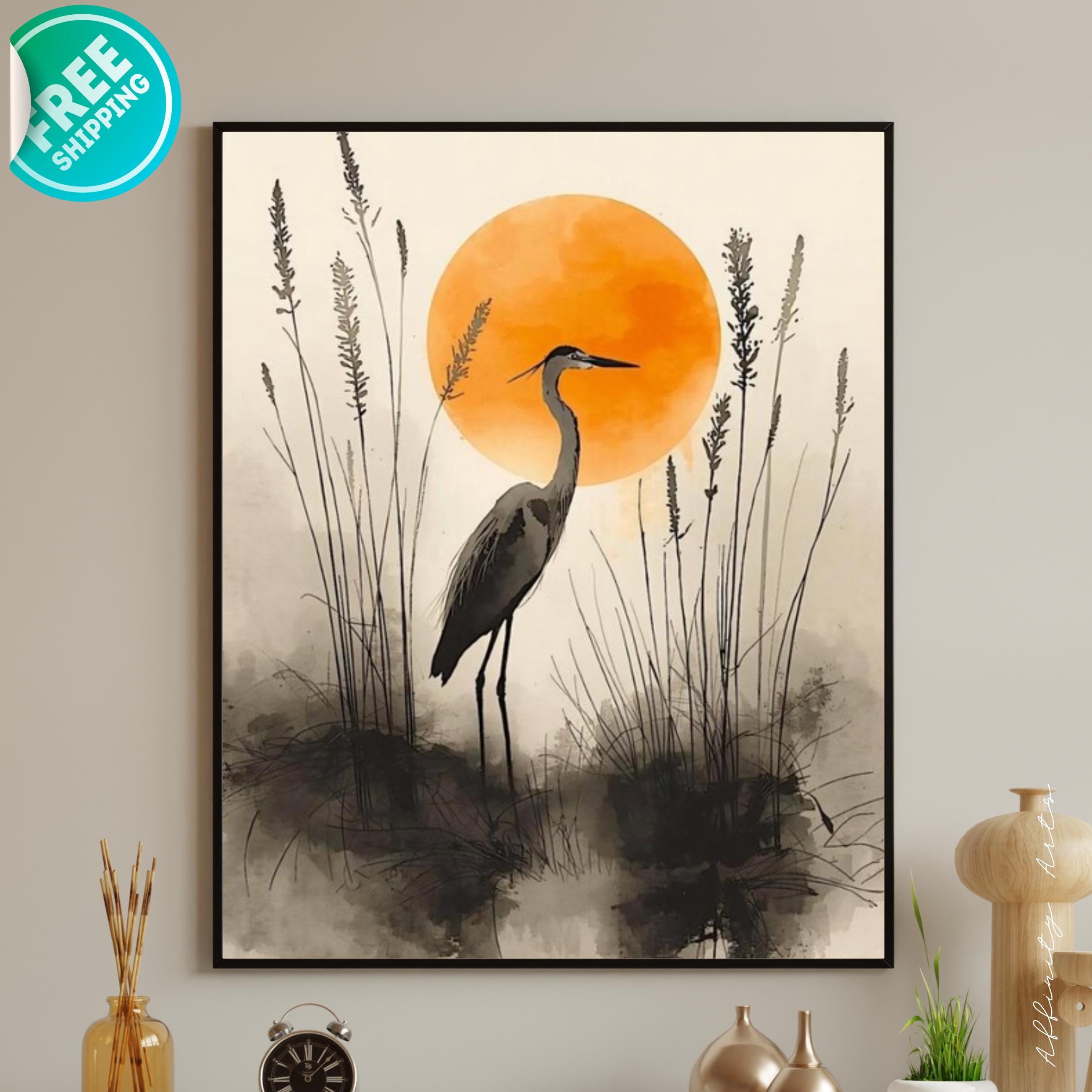 Minimalist watercolor illustration of a heron standing in marsh grass with a large warm orange sun in the background.