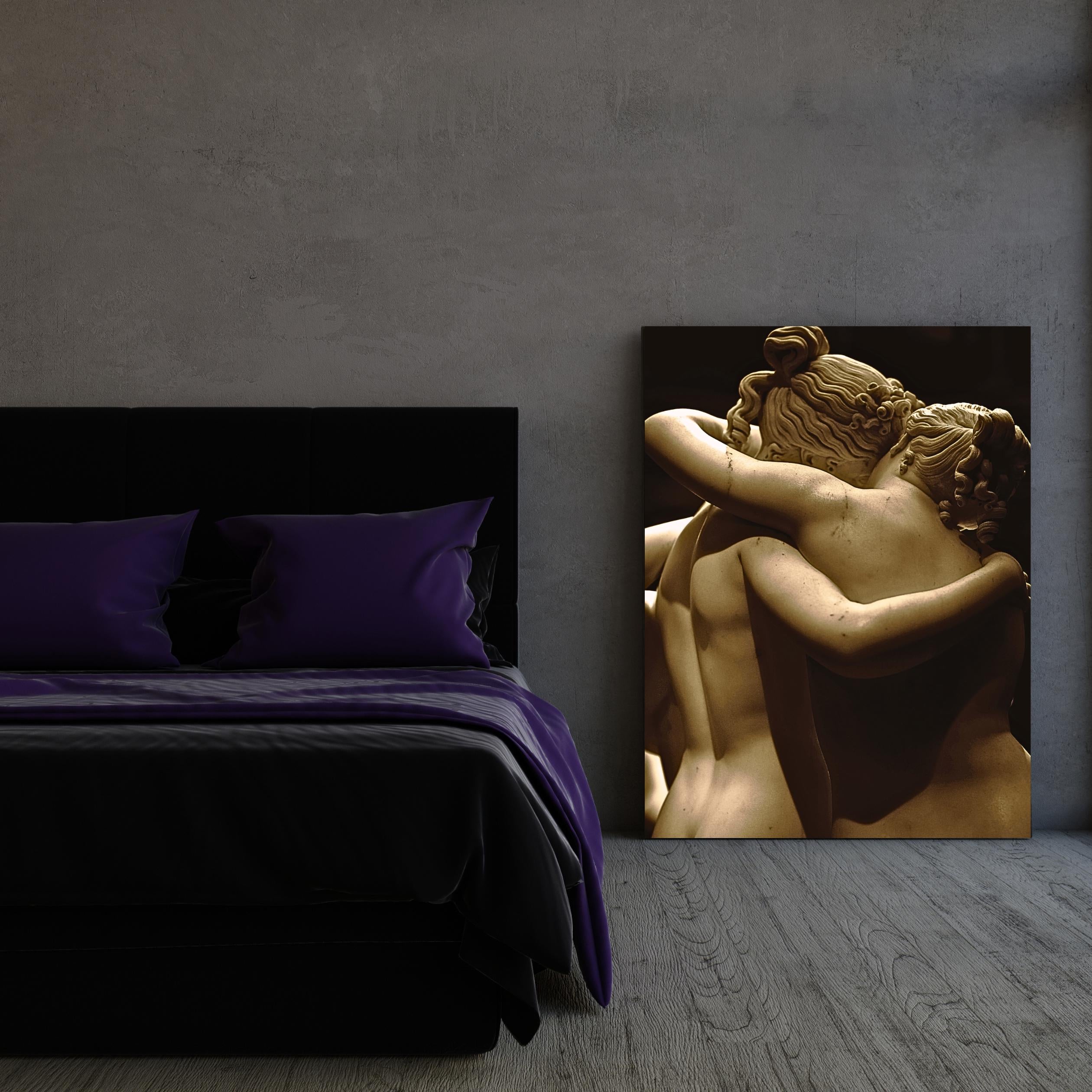 Back view of Canova's Three Graces marble figures hugging.