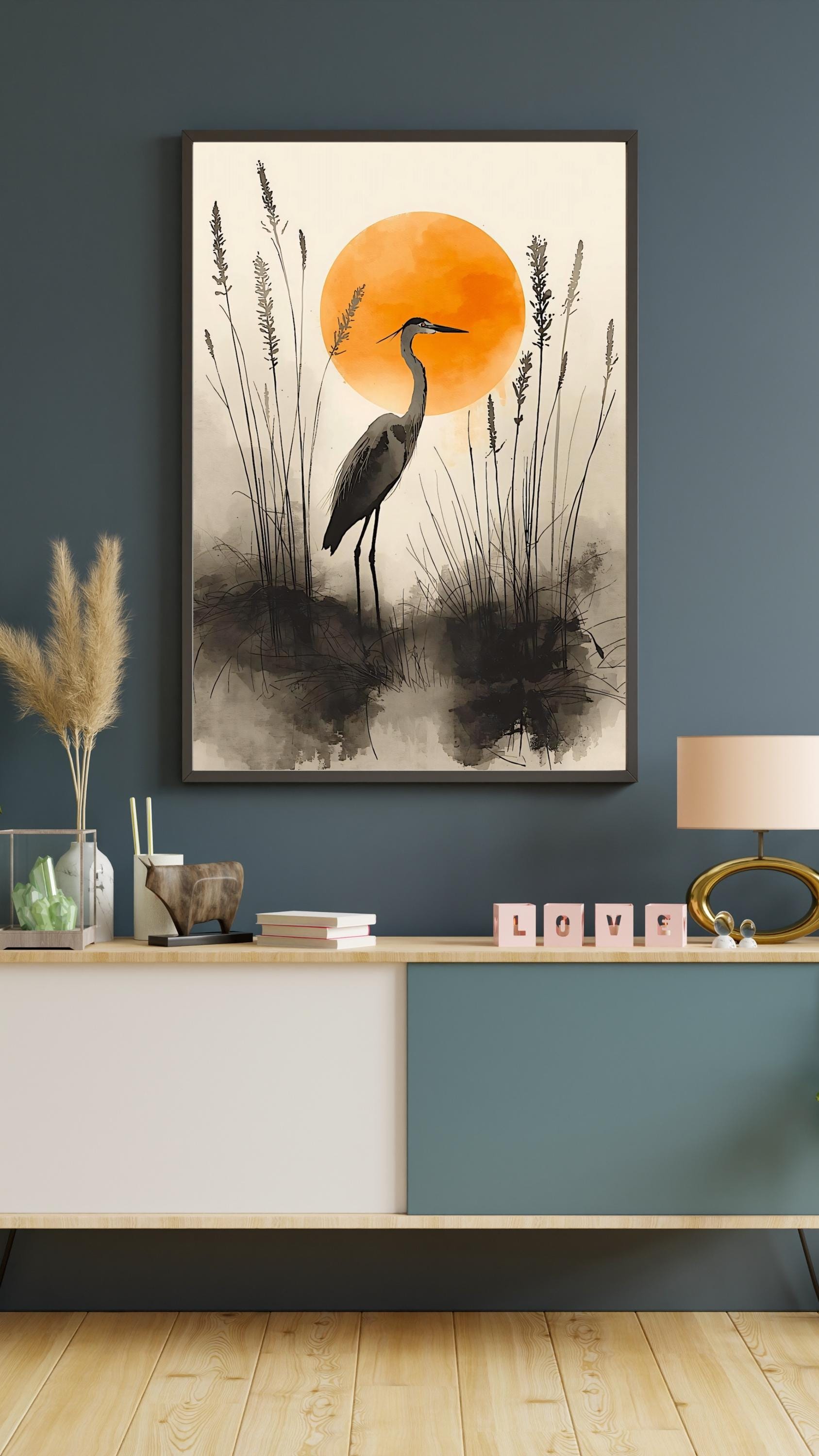 Stylized watercolor heron silhouette in a misty wetland scene with reeds and a glowing orange sun.